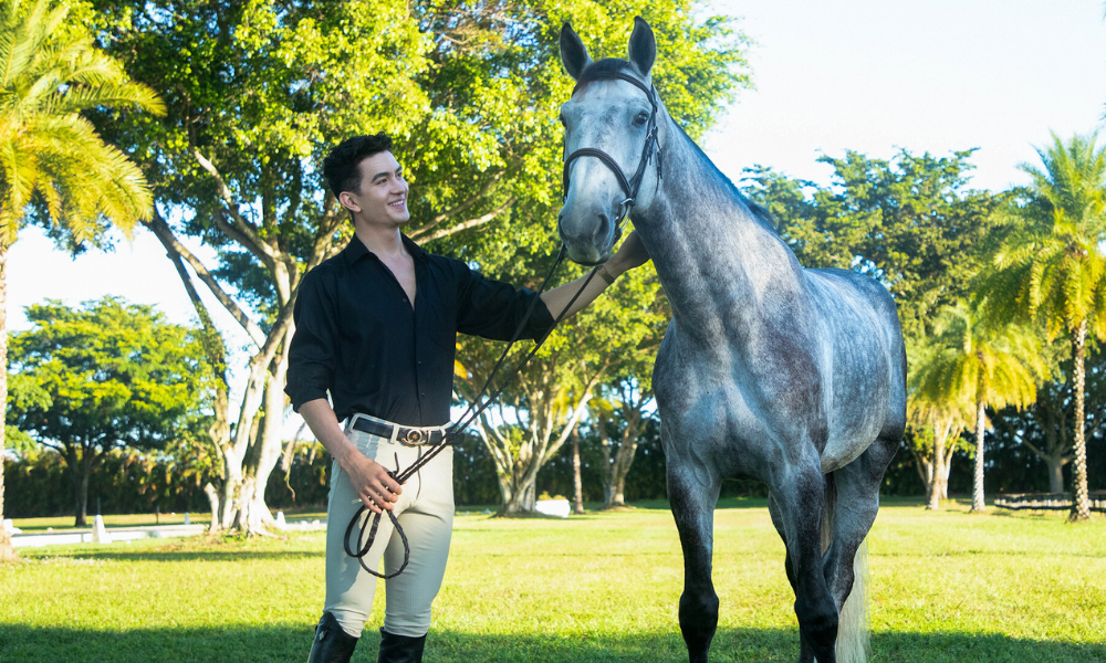 equestrian working with horse in field